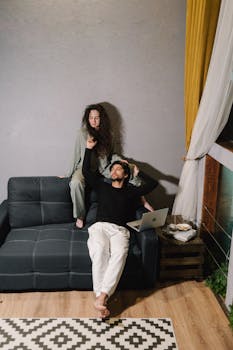 A couple enjoying a peaceful evening indoors, emphasizing relaxation and togetherness.