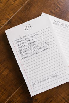 Close-up of a handwritten to-do list on a wooden table for an organized day.
