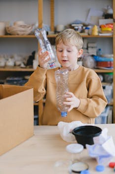 Young boy sorting plastic bottles for recycling, promoting eco-friendly habits.